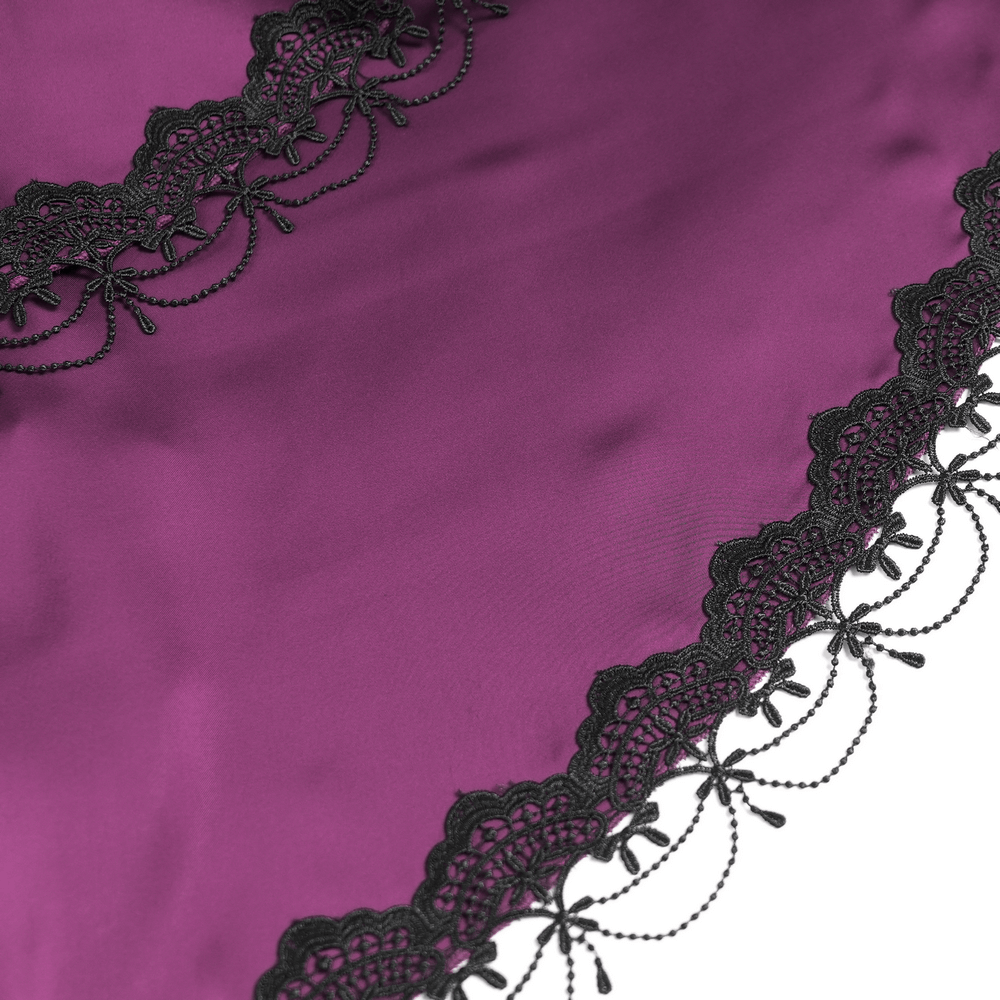 Close-up of luxurious purple satin fabric with intricate black lace trim, perfect for a gothic style.