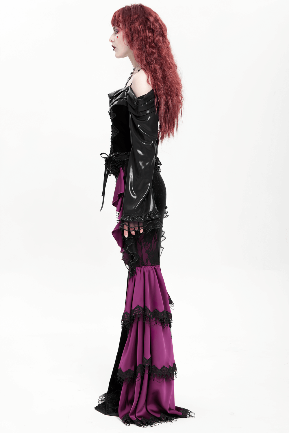 Gothic velvet maxi skirt with purple ruffles and chains, showcasing a dramatic Victorian style.