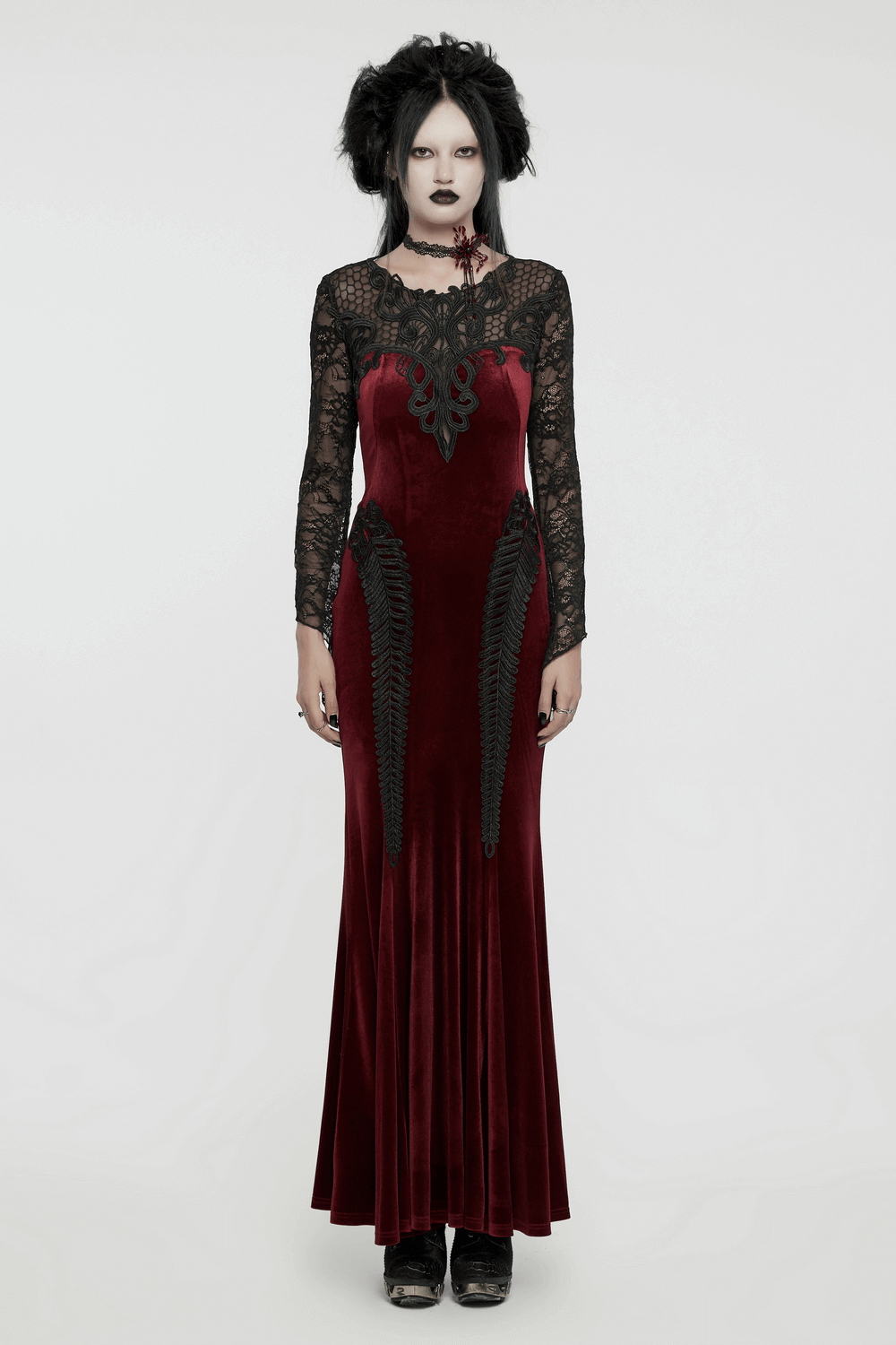 Gothic velvet mermaid dress with lace detailing, showcasing elegance and edge with a flowing silhouette.