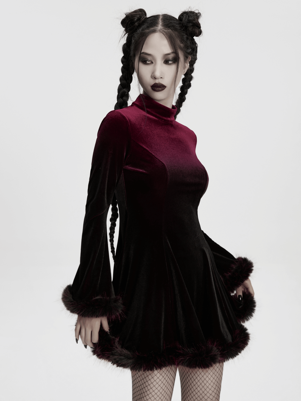 Gothic velvet mini dress with feather trim, featuring a model in a stylish pose, perfect for alternative fashion.