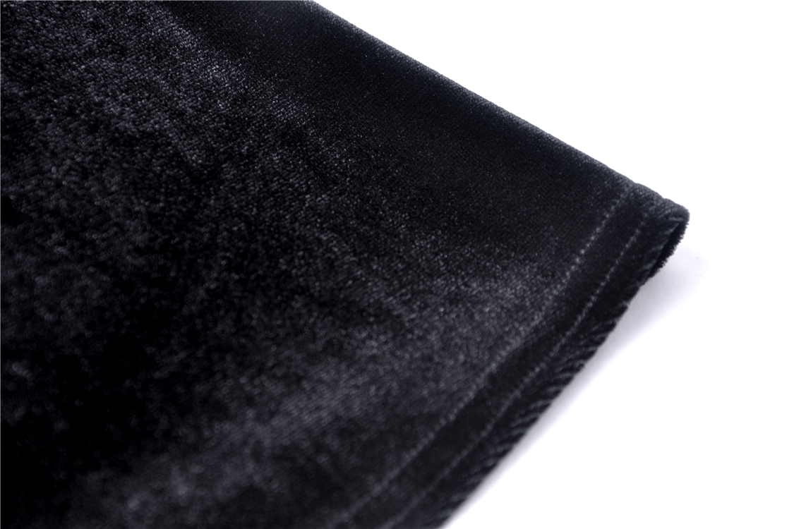 Close-up of soft black velvet fabric showcasing its luxurious texture, ideal for Gothic Victorian fashion designs.