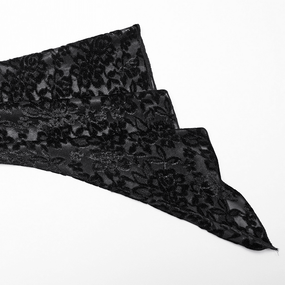 Black floral lace fabric, perfect for gothic fashion, showcasing intricate patterns and soft texture.
