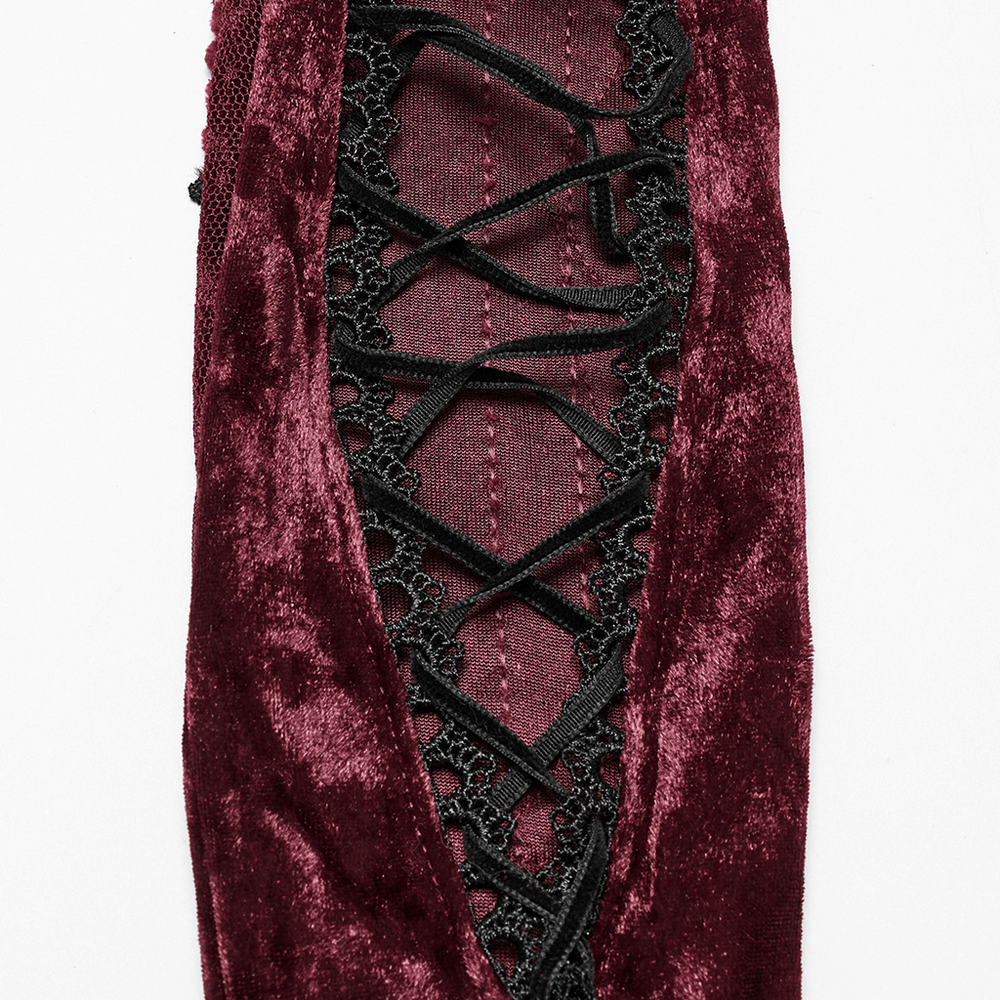 Gothic velvet opera glove close-up featuring black lace embroidery and vintage design details.