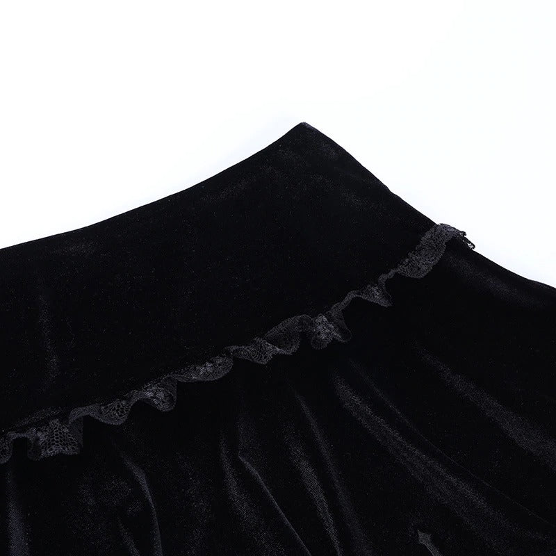 Close-up of a high waist black velvet skirt with lace ruffles, perfect for gothic style fashion.