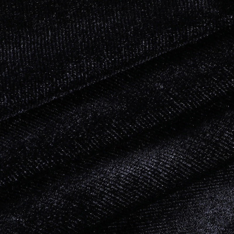 Close-up of luxurious black velvet fabric, perfect for gothic skirts with a smooth texture and rich color.