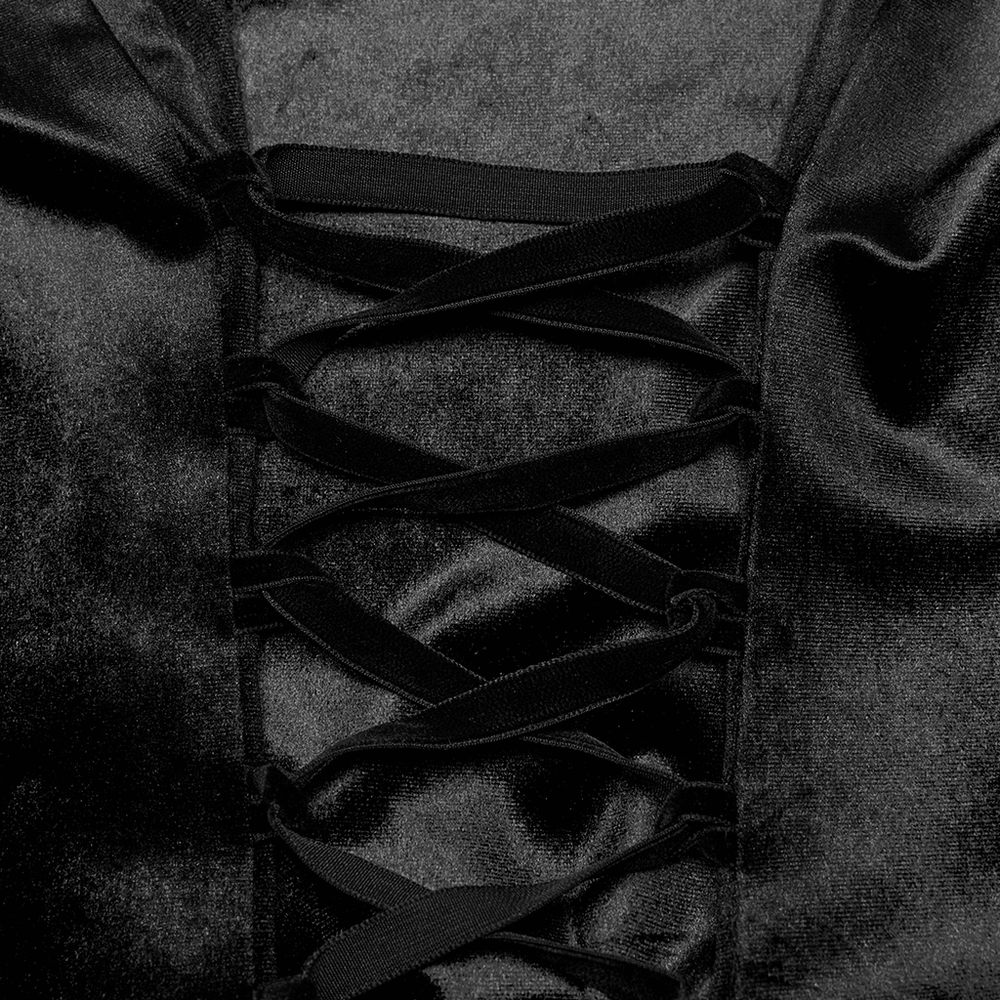 Close-up of the lace-up back detail on a gothic velvet shirt, showcasing luxurious black velvet and intricate lacing.