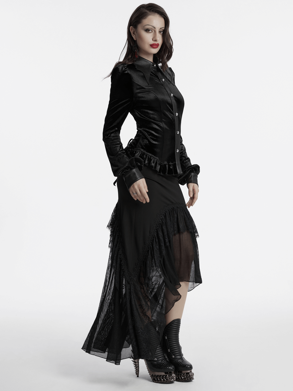 Gothic velvet shirt with bat collar, lace-up back, and ruffled hem, styled with a flowing black skirt.
