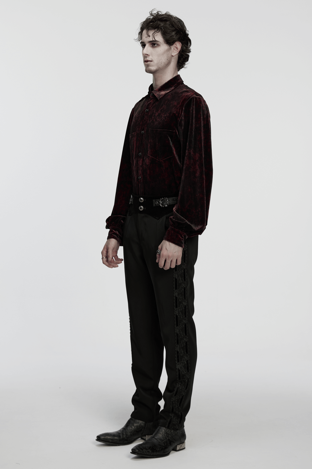Gothic Velvet Shirt with Button Detail and Long Sleeves worn by a model, showcasing rich dark red and black patterns.