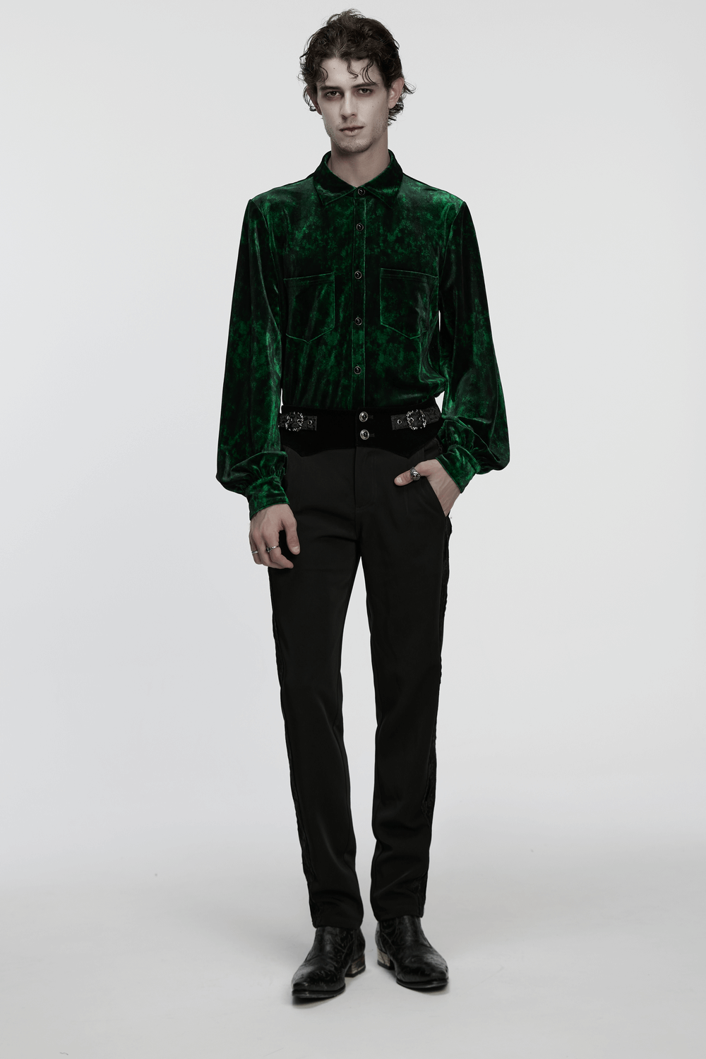 Gothic Velvet Shirt with Pearl Buttons for Daily Wear modeled by a man in a sleek green velvet shirt and black pants.