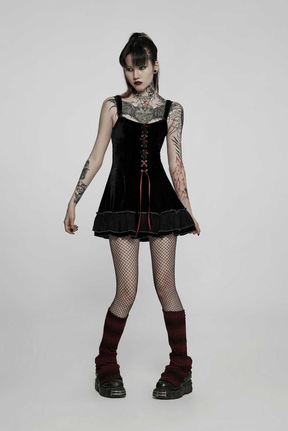 Gothic velvet spider web design dress set on a model, showcasing intricate details and a playful gothic aesthetic.
