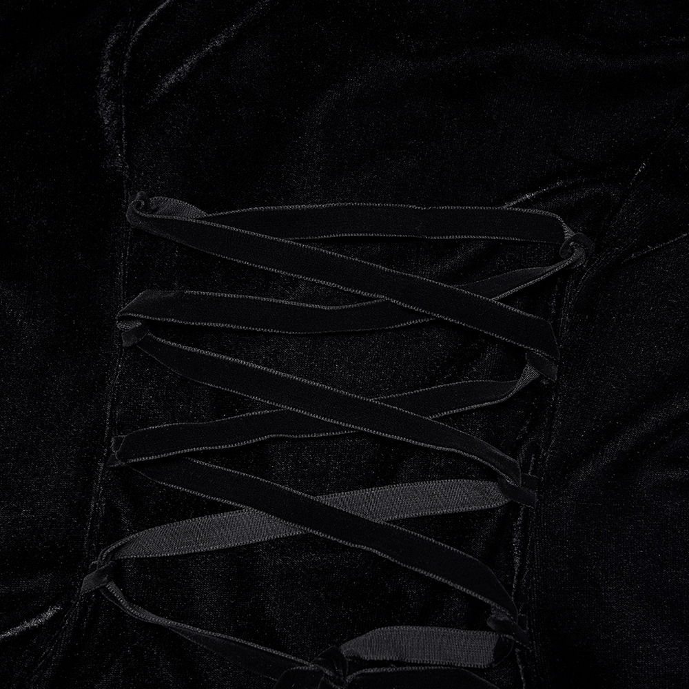 Close-up of gothic black velvet dress featuring intricate lacing detail for stylish adjustments.