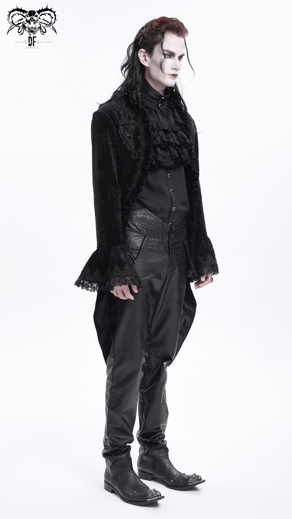 Stylish man in a gothic velvet swallowtail jacket with lace details, embodying dark elegance and Victorian flair.