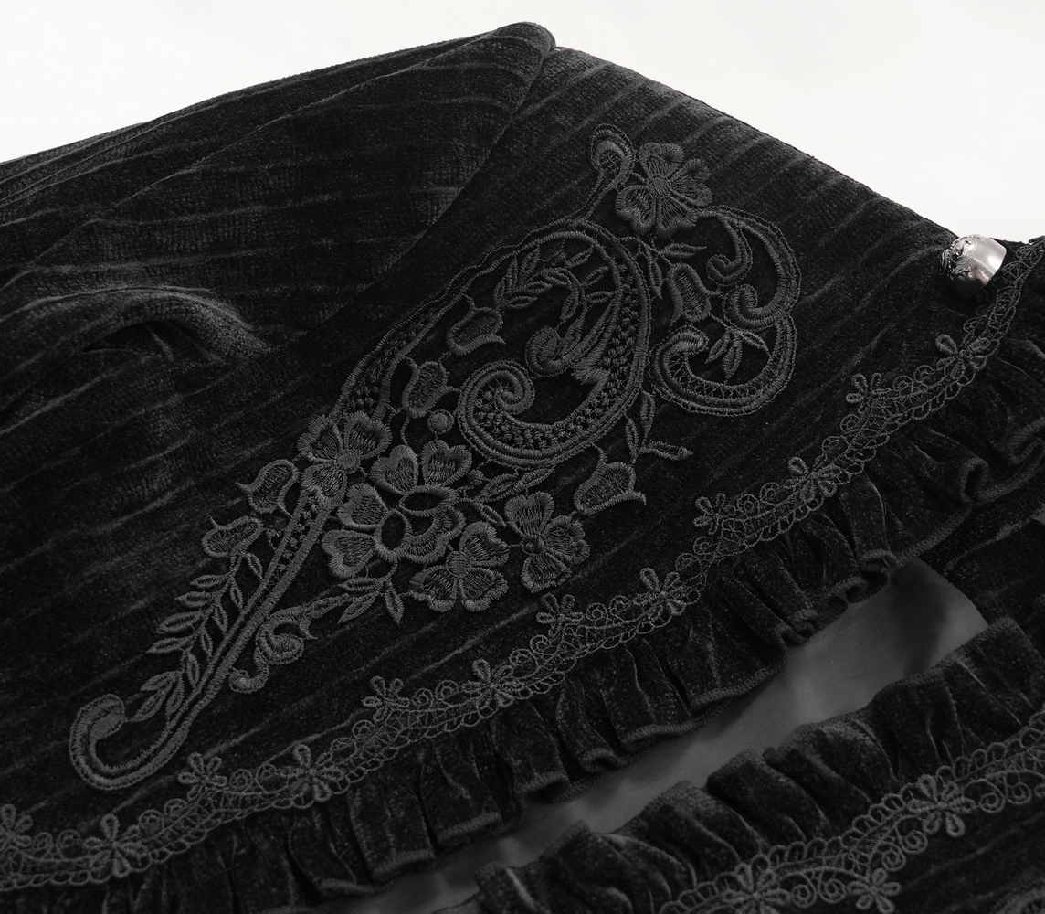 Embroidered detailing and lace trim on a Gothic velvet swallowtail jacket, showcasing dark elegance and Victorian style.