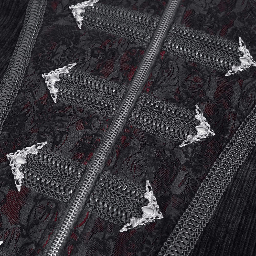 Close-up of gothic velvet tailcoat detailing with ornate silver accents and intricate embroidery.