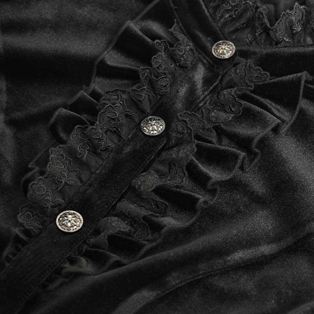 Close-up of Gothic Victorian black velvet blouse with lace ruffles and decorative buttons.