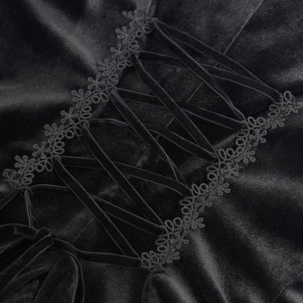 Close-up of black velvet blouse lace-up back detail with elegant lace trim accents.