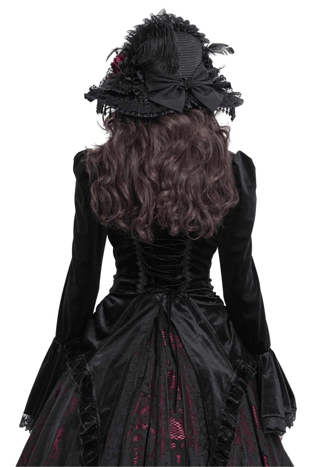 Elegant black velvet blouse with ruffled sleeves and lace-up back, paired with a vintage gothic hat.