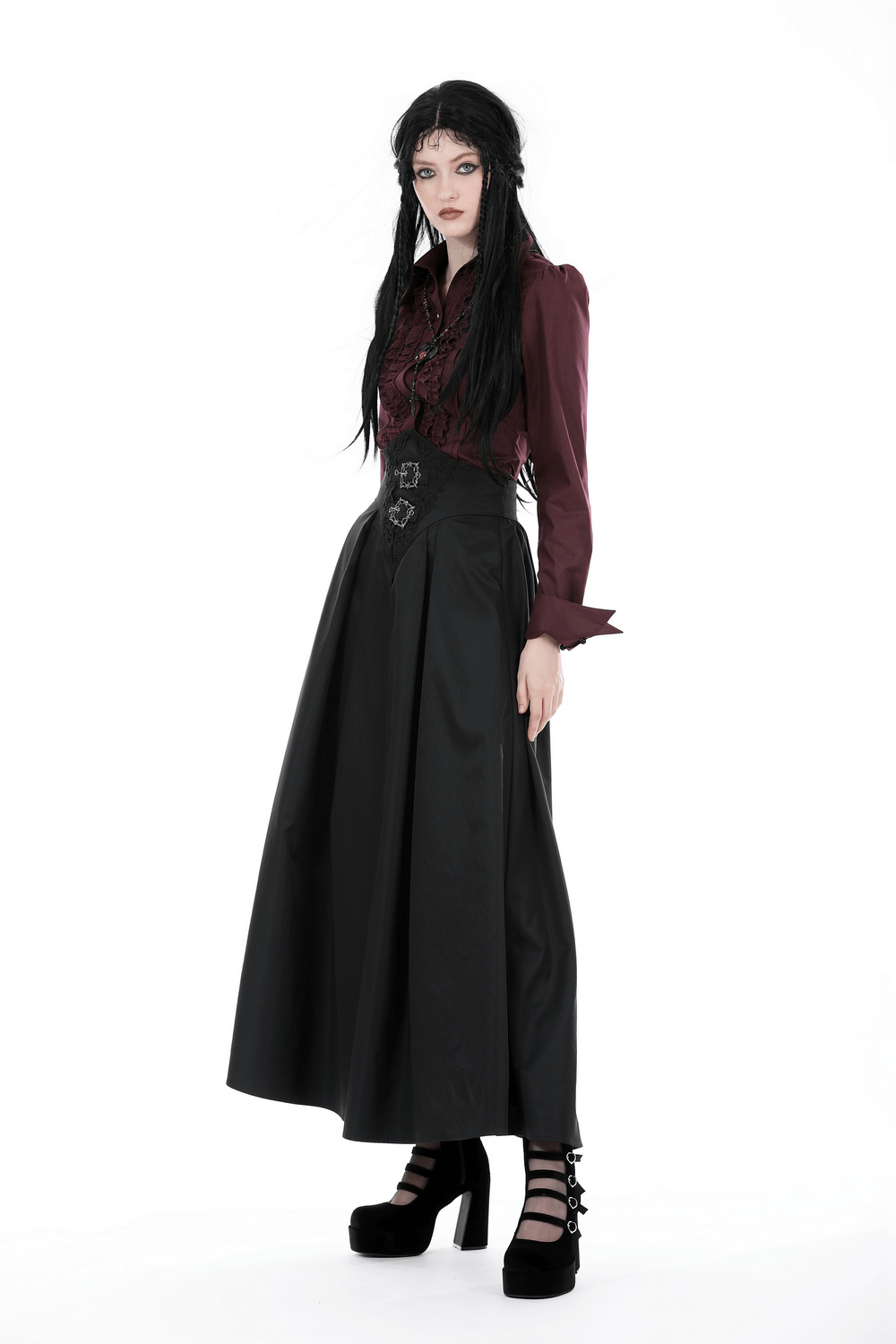Gothic Victorian burgundy blouse with ruffles and lace, paired with a long black skirt and platform shoes.