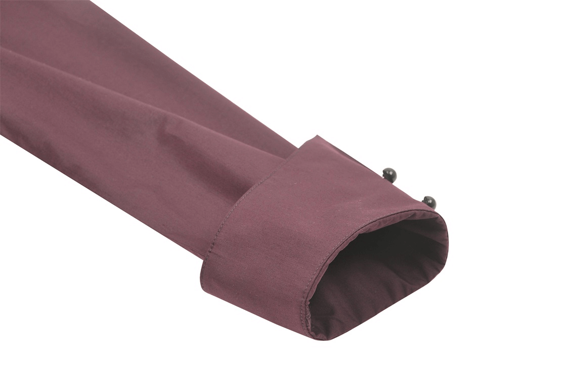 Close-up of the burgundy sleeve cuff of a Gothic Victorian blouse with decorative buttons.