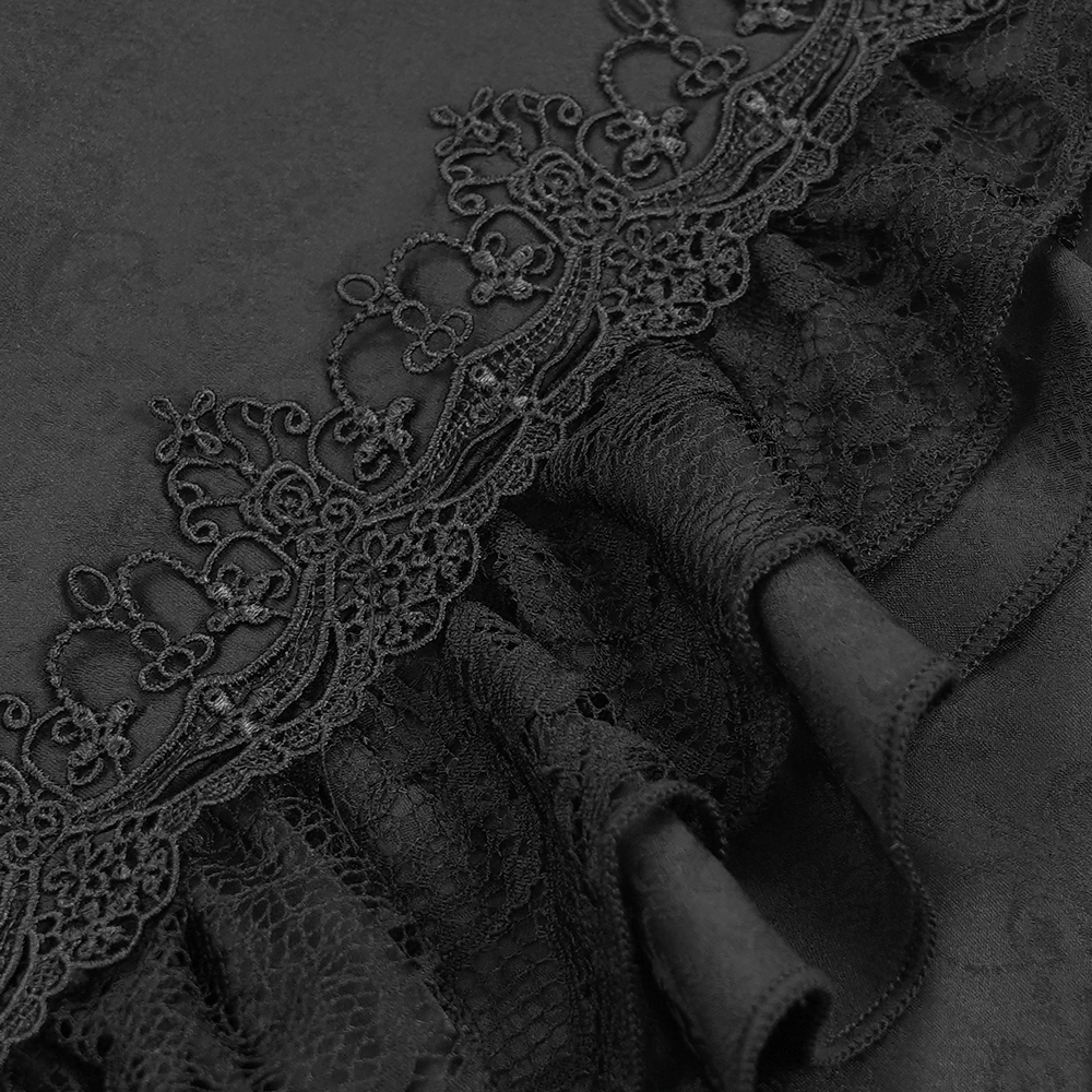 Close-up of intricate black lace and ruffle detailing on a Gothic Victorian shirt, showcasing elegance and dark romanticism.