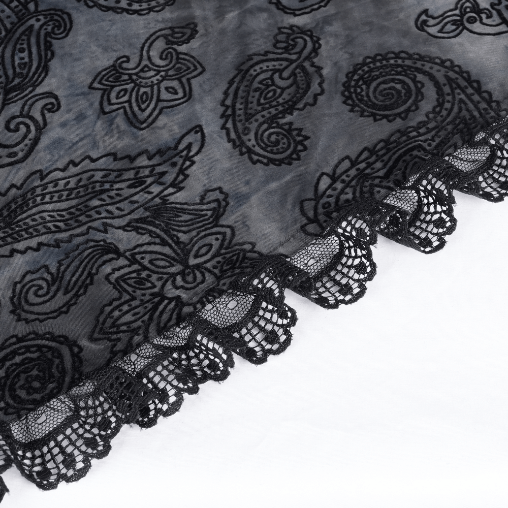 Elegant black lace trim on a sheer scarf featuring intricate paisley patterns, perfect for gothic fashion.