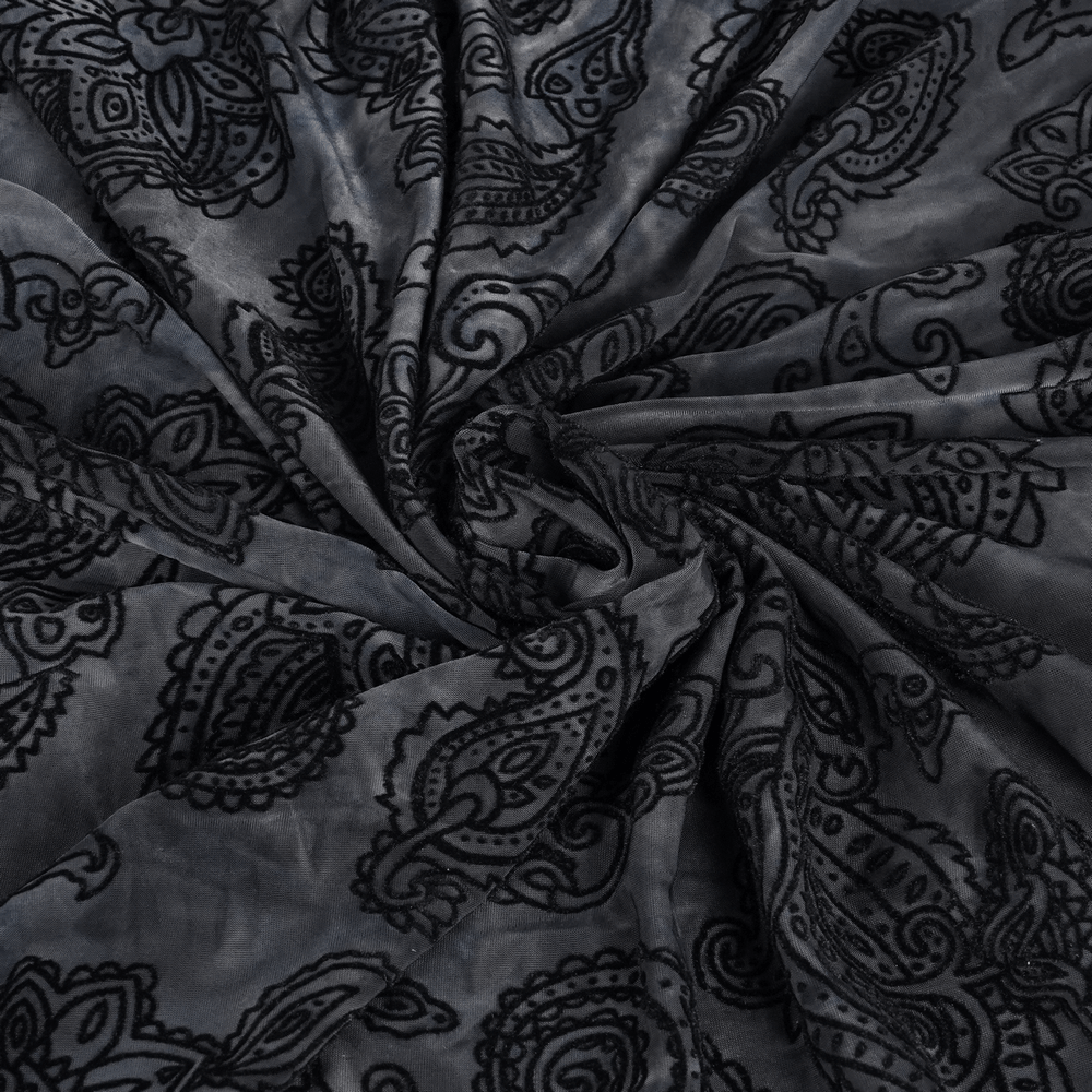 Black velvet fabric with intricate paisley pattern for elegant clothing and accessories. Perfect for gothic or luxurious designs.