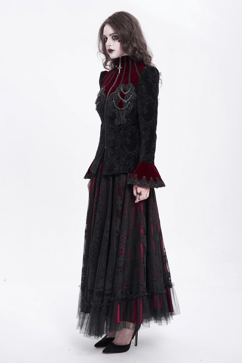 Gothic Victorian jacket with chains and bell sleeves, paired with a voluminous black and red skirt for a striking steampunk look.