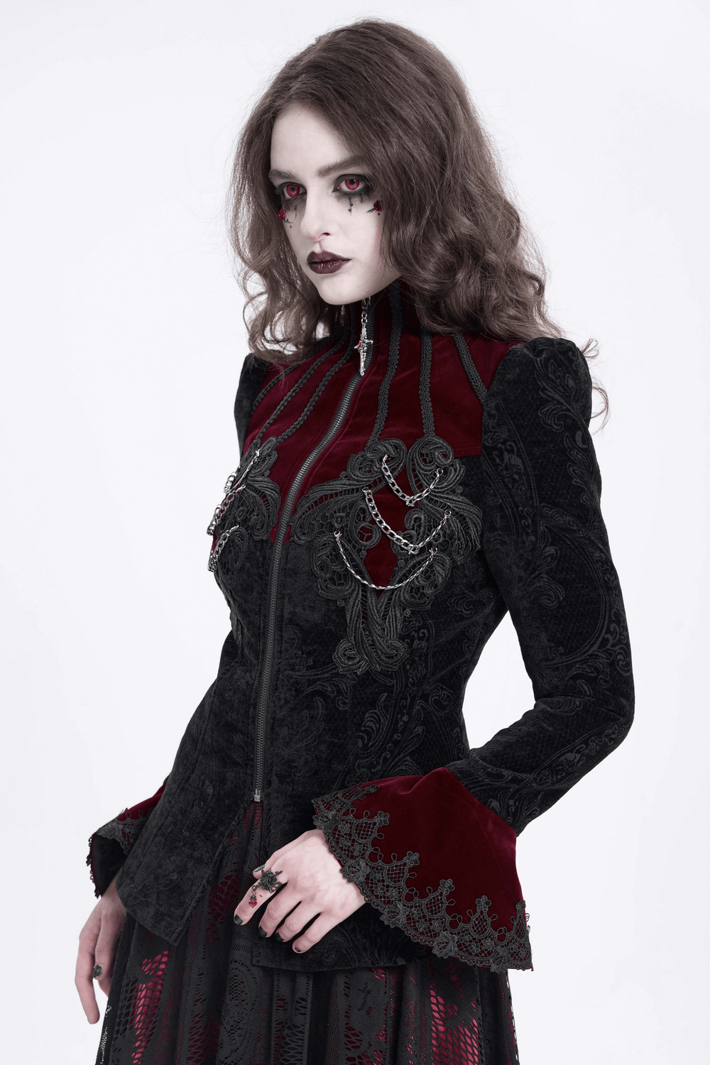 Gothic Victorian jacket with chains and bell sleeves, styled elegantly with intricate embroidery in a dark aesthetic.