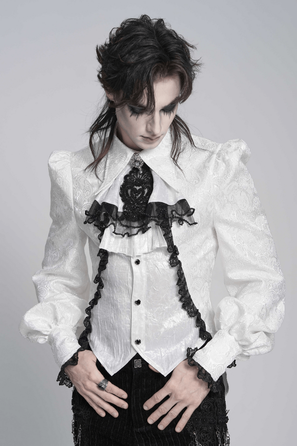 Gothic Victorian Lace Jabot Collar With Brooch worn by a model in a stylish white blouse.