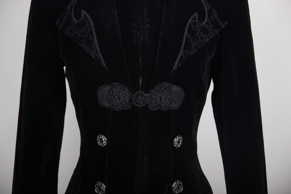 Close-up of a women's black Gothic vintage trench coat featuring embroidered details and stylish buttons.