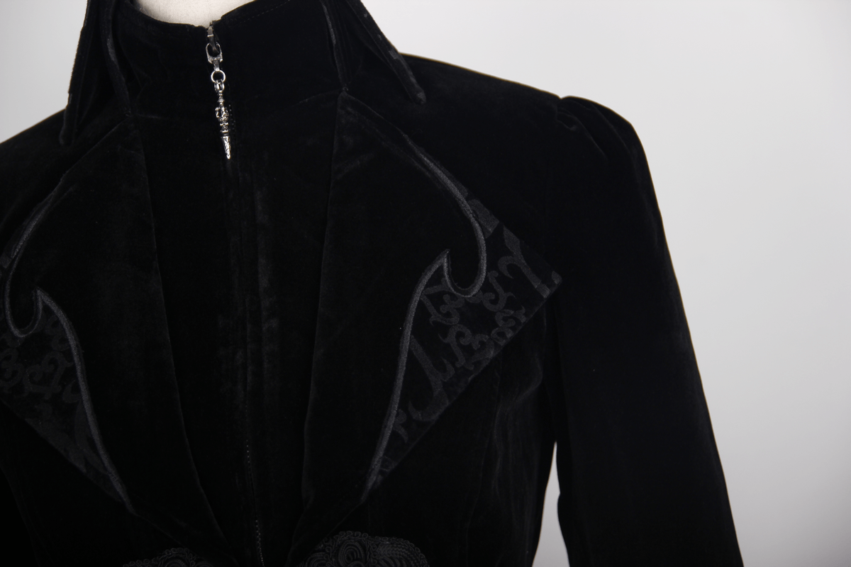 Close-up of a Gothic vintage women's black trench coat with elegant embroidery and a stylish collar.