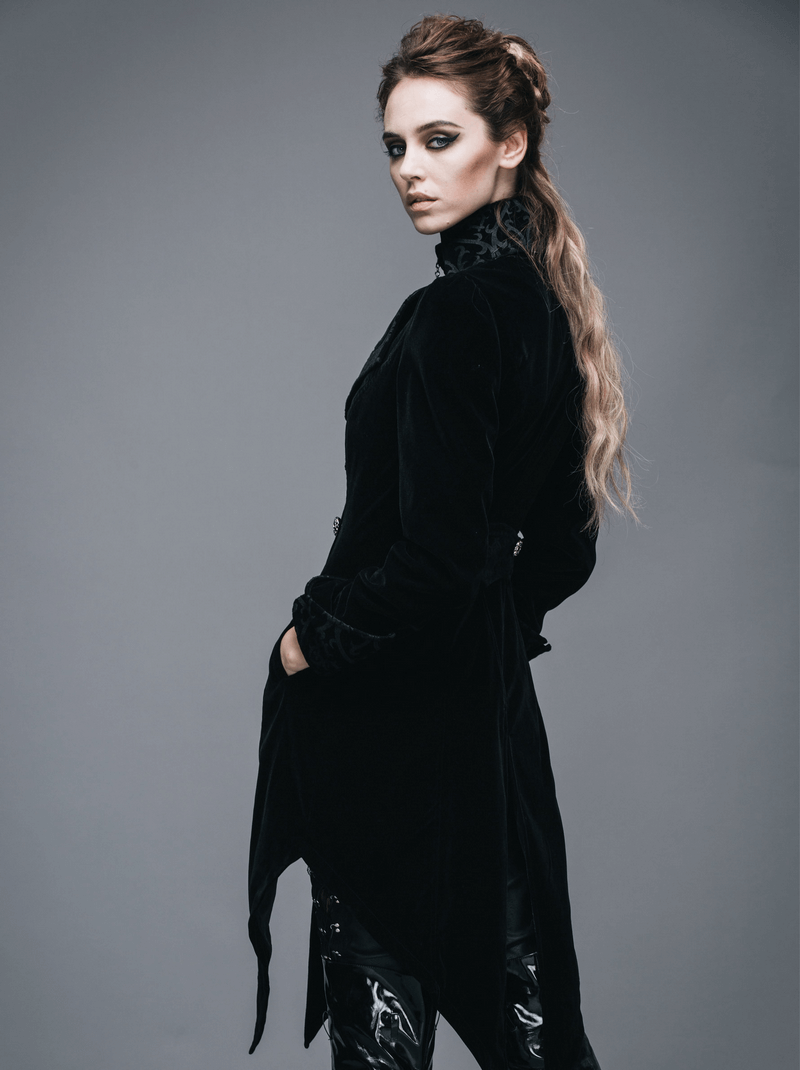 Woman wearing a gothic vintage black trench coat with steampunk design, showcasing retro elegance and style.