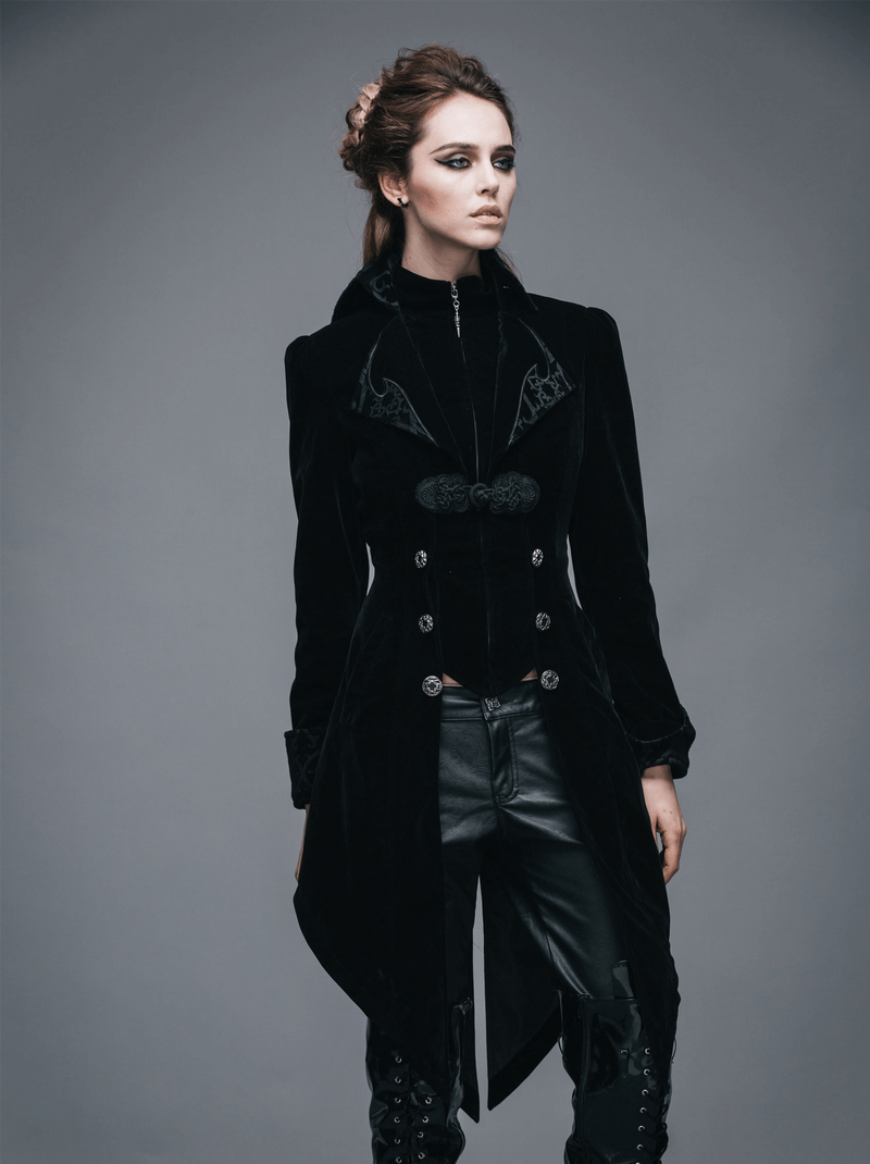 Stylish woman wearing a gothic vintage black trench coat, showcasing steampunk embroidery and a fitted silhouette.