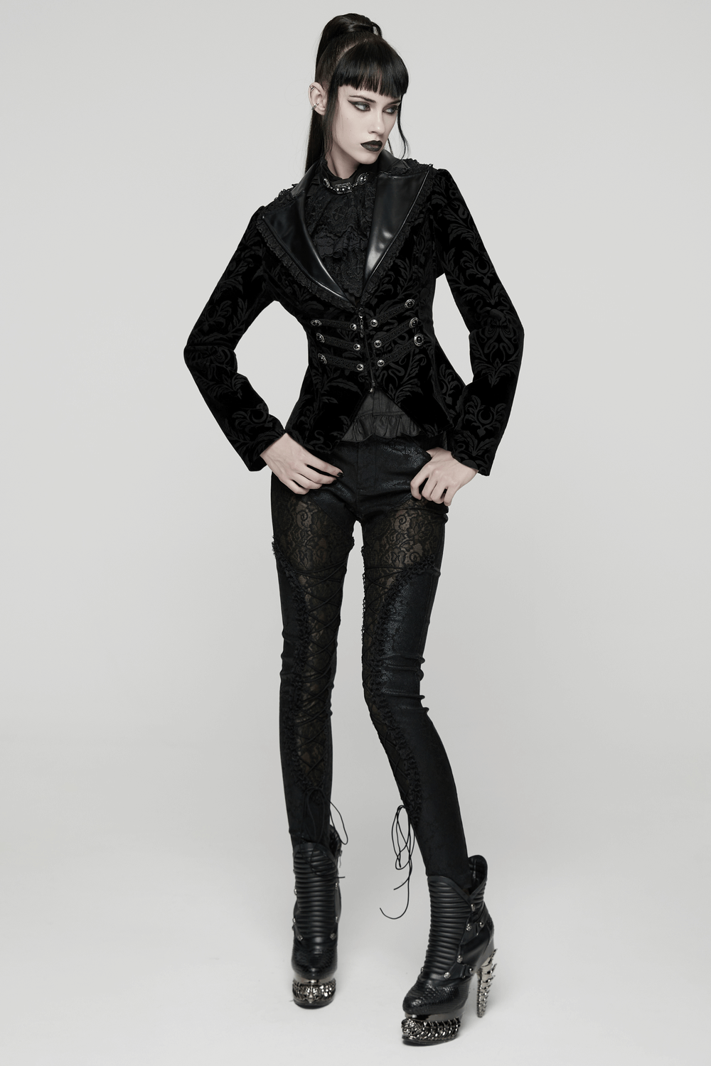 Gothic Vintage Lace-Up Velvet Jacket with Gemstone Buttons worn by model with dramatic style and lace-trimmed details.