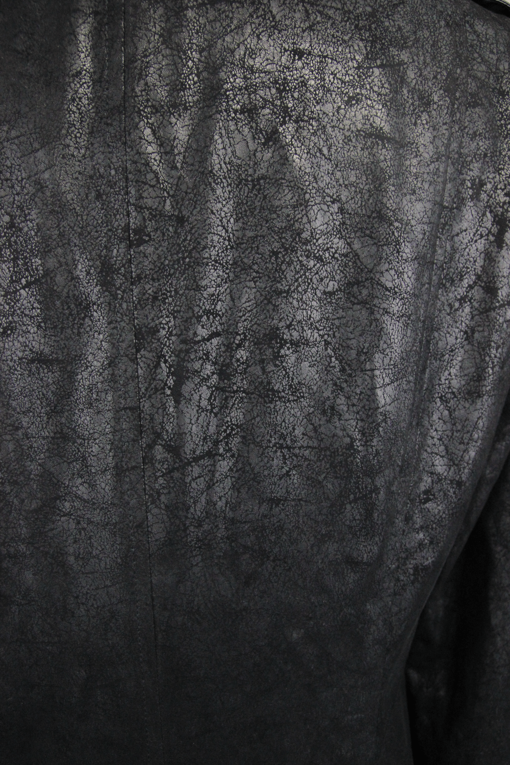 Close-up of textured black fabric on a gothic vintage long men's coat, showcasing its luxurious PU leather finish.