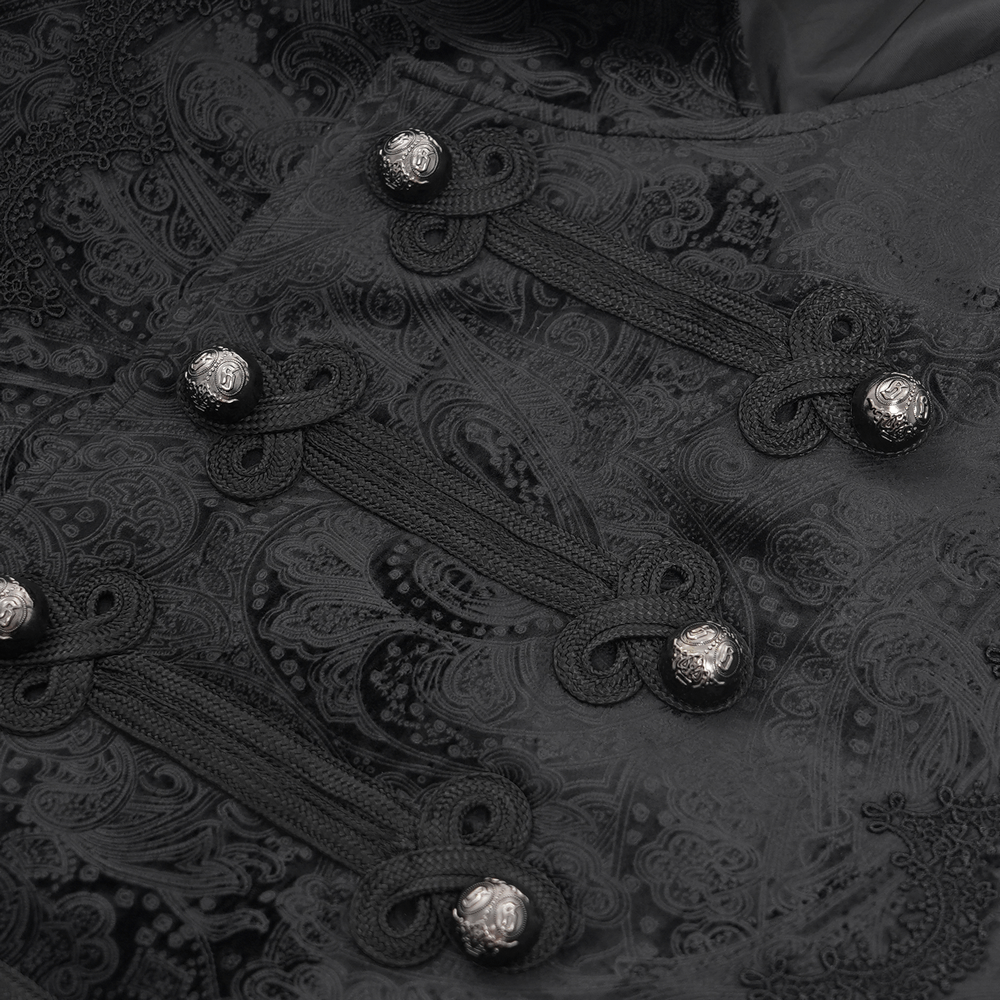 Gothic waistcoat close-up featuring intricate embroidery and decorative silver buttons. Elegant design for men.