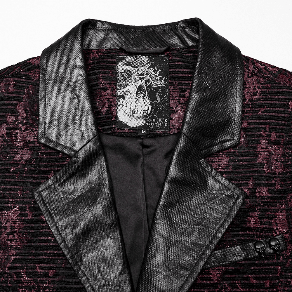 Close-up of Gothic waistcoat collar featuring black leather and jacquard fabric with a skull accent on the label.