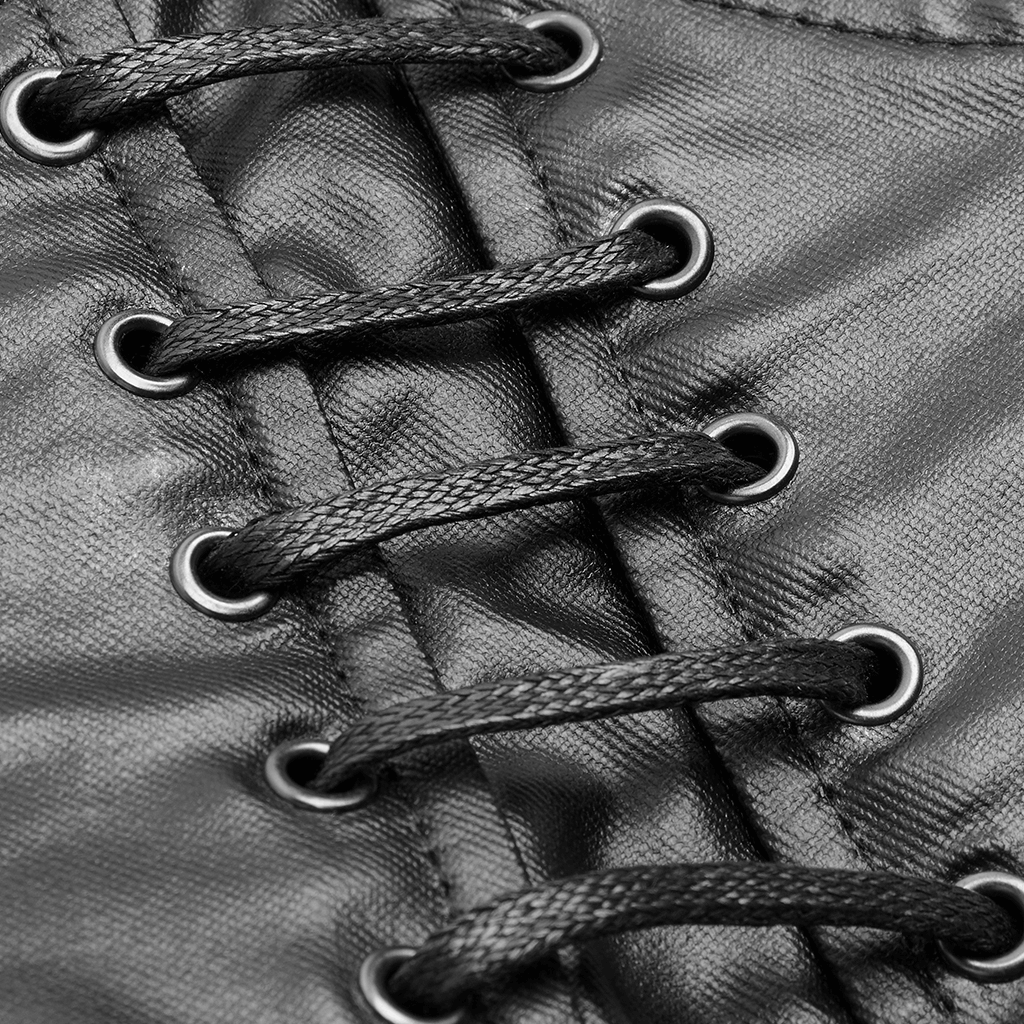 Close-up of black corset lacing with metallic eyelets and textured fabric.
