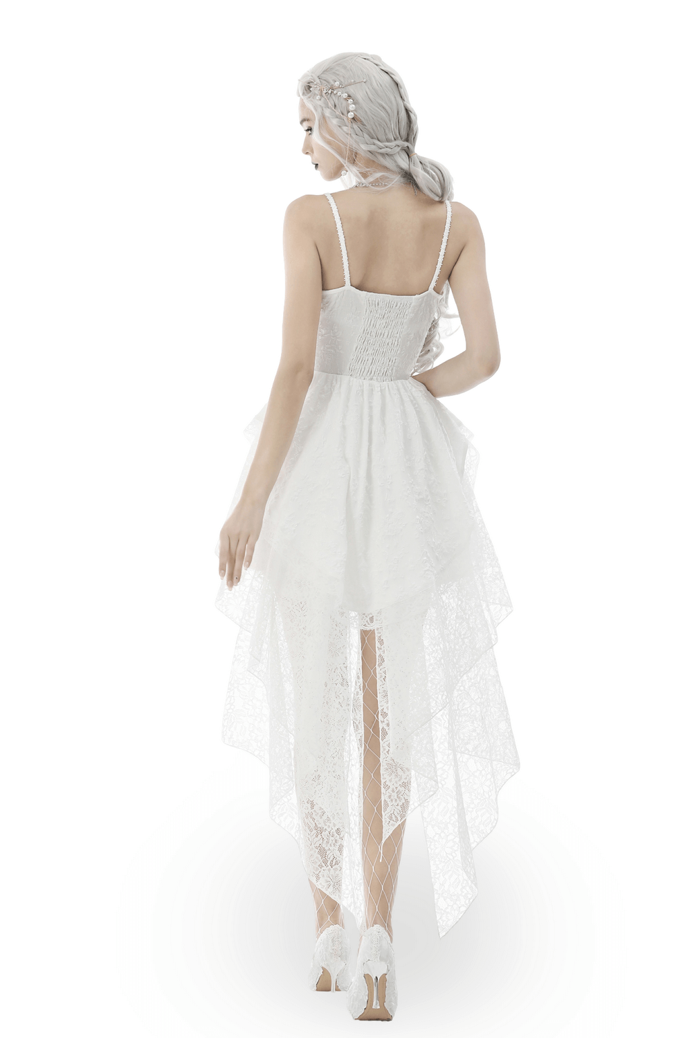 Gothic white butterfly dress seen from the back, featuring an asymmetrical hem and delicate lace fabric.