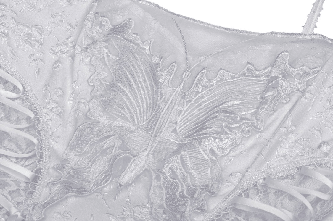 Close-up of butterfly embroidery on Gothic White Butterfly Dress with intricate details and lace.