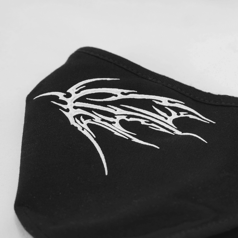 Gothic black face mask featuring intricate white tribal wing design, perfect for a stylish unisex accessory.