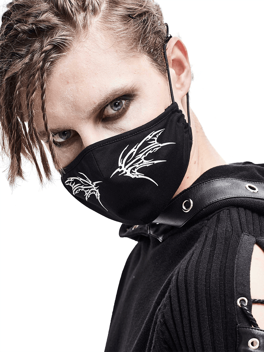 Gothic style unisex black butterfly face mask on model with adjustable bands, featuring striking white butterfly wing design.