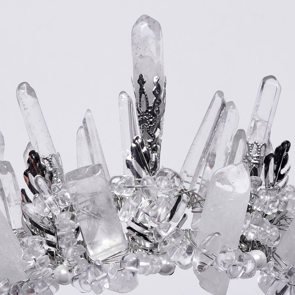 Close-up of a gothic crown featuring clear crystals and frosted spikes, showcasing intricate handcrafted details.