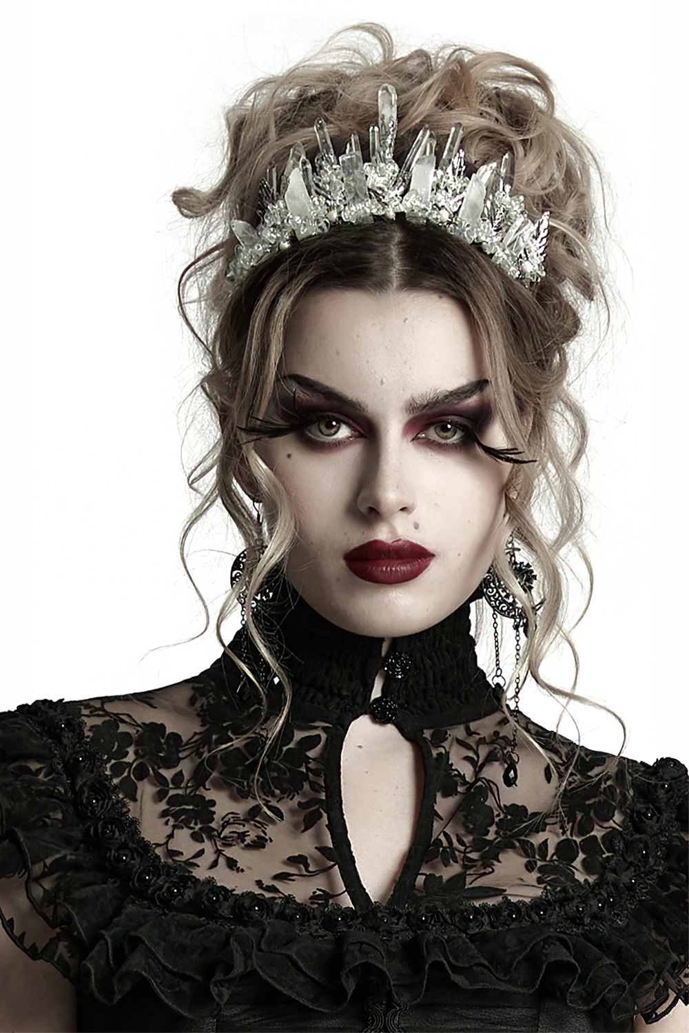 Gothic white crystal crown with frosted spikes worn by a model, showcasing a striking winter-inspired headband.