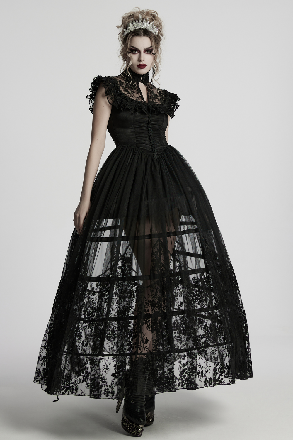 Elegant gothic black lace dress with ruffled sleeves, featured in a dramatic gown silhouette, perfect for alternative fashion.