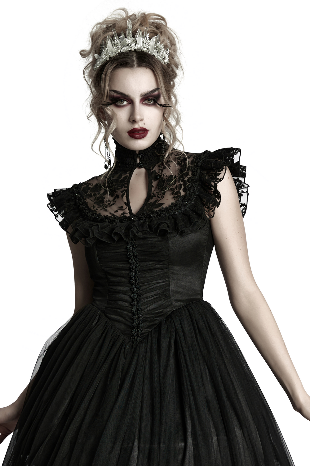 Gothic model wearing a black dress and frosted crystal crown, showcasing a dramatic and elegant alternative fashion style.