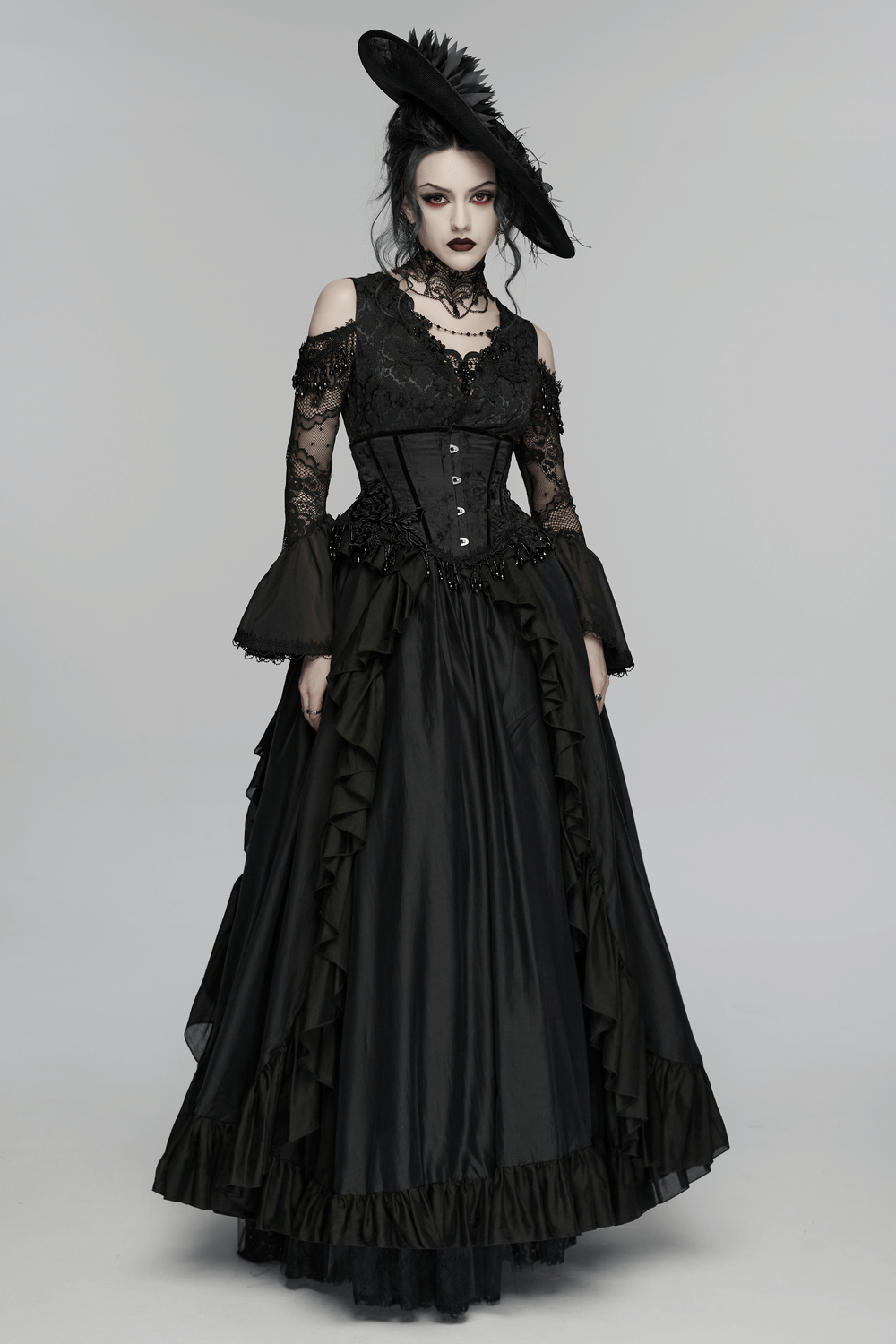 Gothic Wide Brim Feather Fascinator Hat in Black paired with a stunning black gown for a dramatic gothic look.