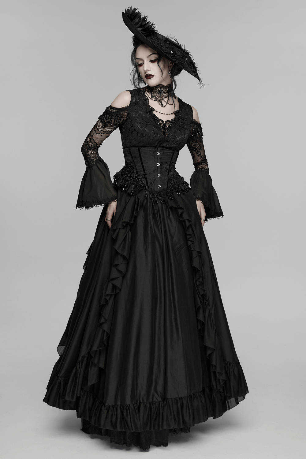 Gothic Wide Brim Feather Fascinator Hat in Black worn with a dramatic black Victorian gown, showcasing elegant goth fashion.