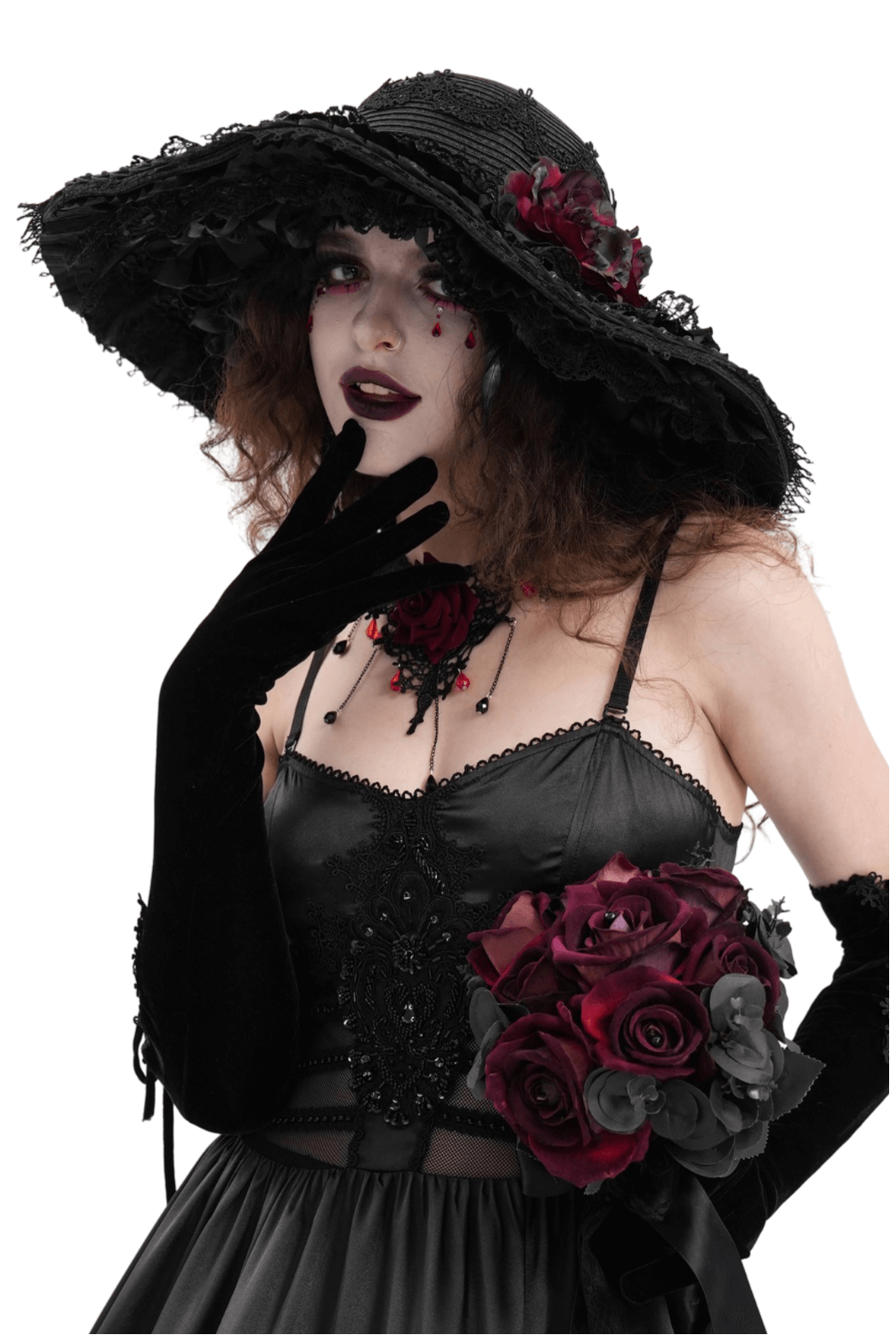 Gothic wide-brim hat with black lace and red floral accents, worn with a dark Victorian dress and a bouquet of roses.