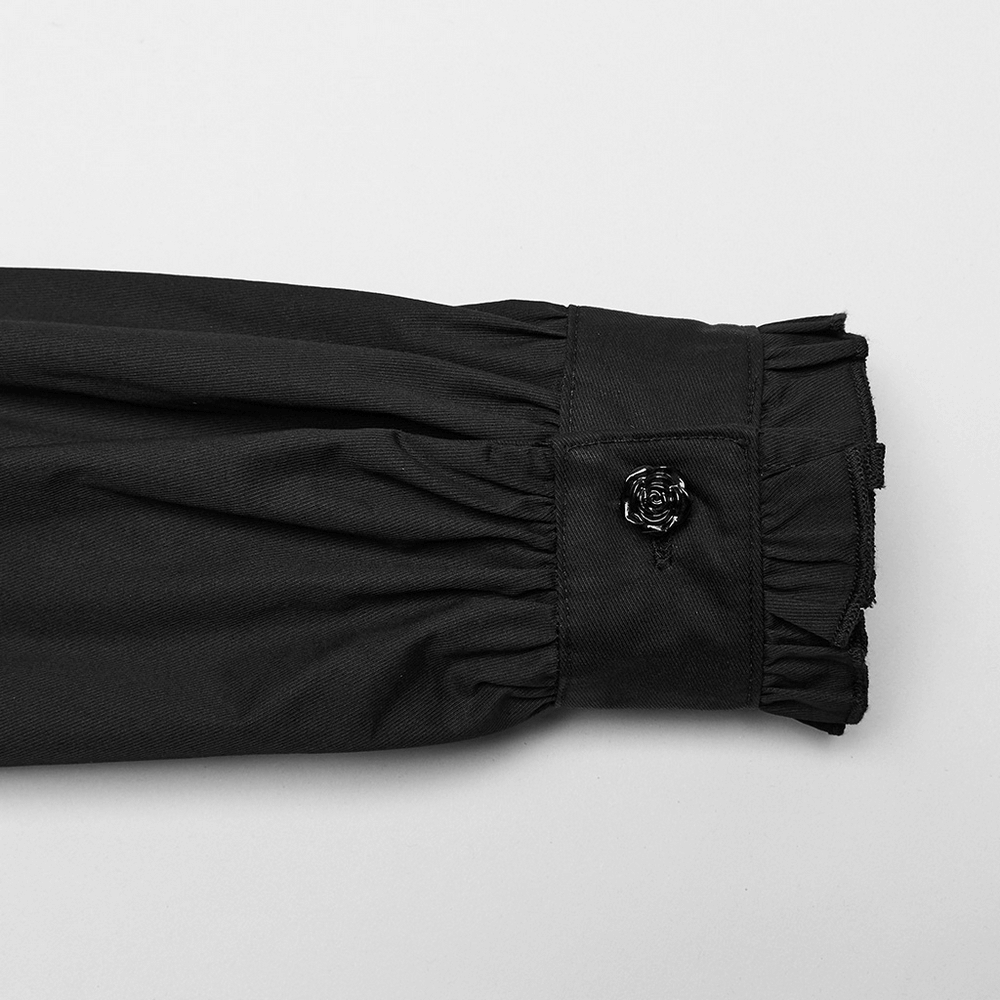 Close-up of Gothic shirt sleeve showing ruffle details and hand-sewn rose button accent.